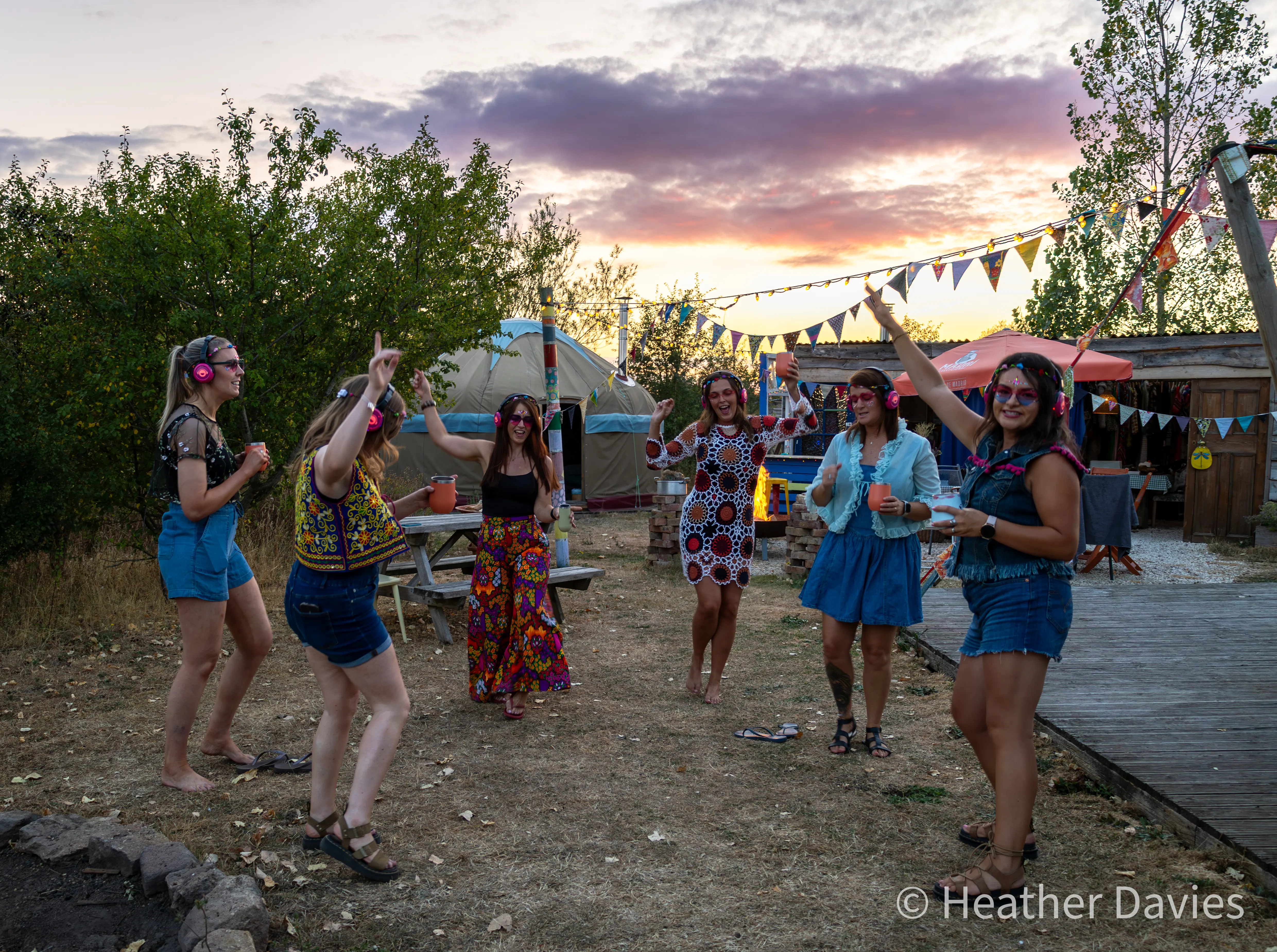 Friends dancing outdoors at sunset during Bec's 40th birthday celebration